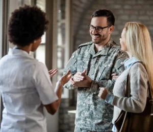 happy army soldier and his wife communicating with healthcare worker